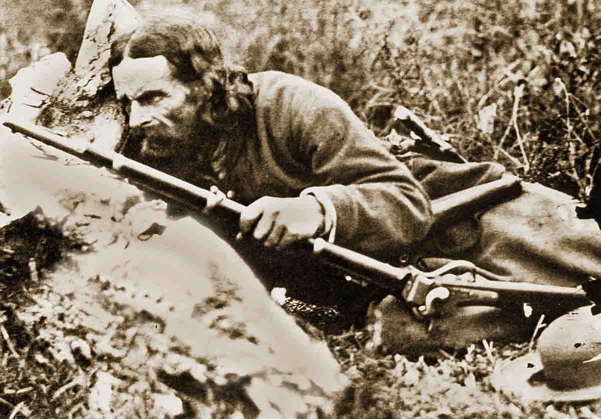 The famous sharpshooter “California Joe” with his privately purchased Sharps New Model 1859 rifle. Note the saber bayonet lug on the barrel, and the saber bayonet on his left hip. The rifle originally had a single trigger, and was converted to a double-set trigger, perhaps by the unit armorer. Joe was one of the oldest members of the regiment, and the younger soldiers truly admired him, because of his experience and his “tall tales” about California.